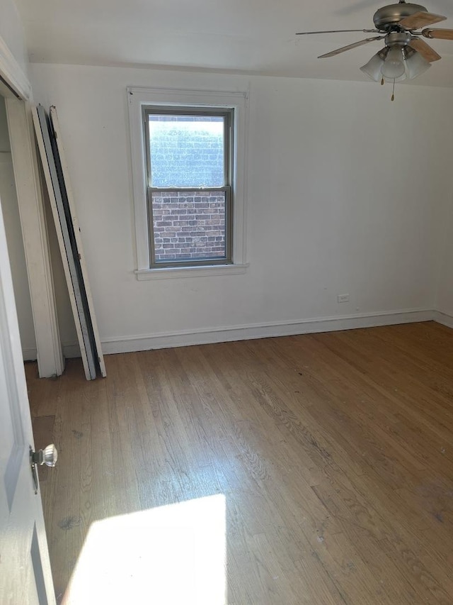 unfurnished bedroom featuring ceiling fan and light hardwood / wood-style flooring