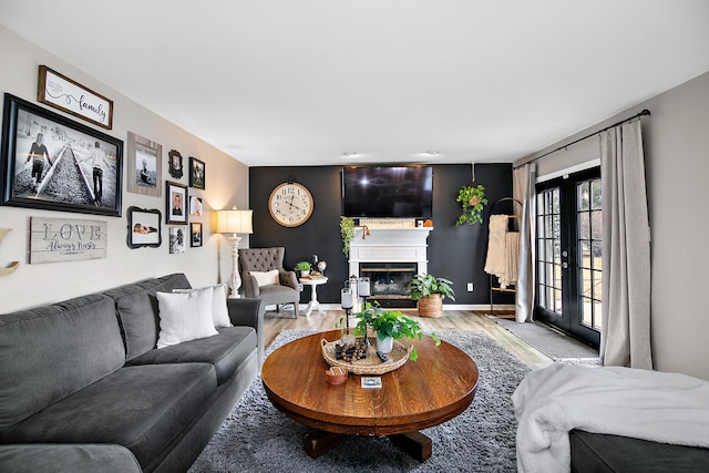 living room with hardwood / wood-style floors and french doors