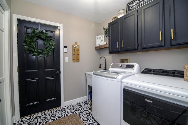 laundry area with tile patterned flooring, cabinets, and washing machine and clothes dryer