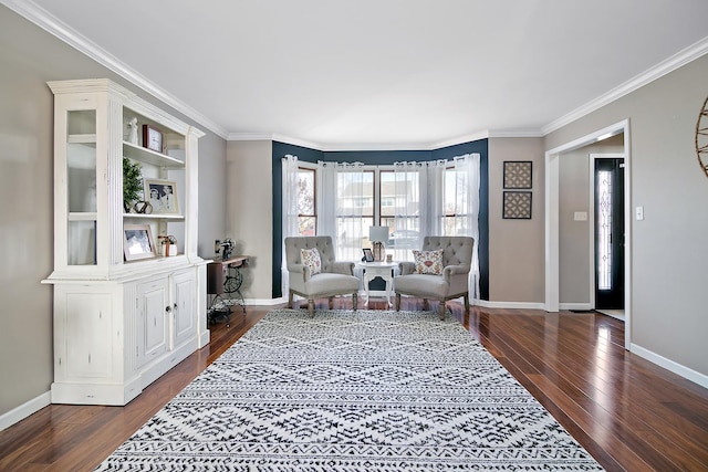 living area featuring dark wood-type flooring and crown molding