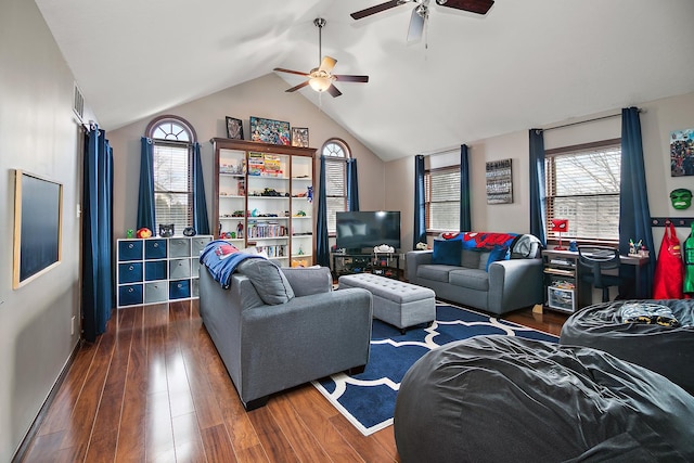 living room featuring lofted ceiling, a healthy amount of sunlight, and dark hardwood / wood-style floors