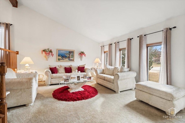 living room with lofted ceiling and carpet flooring