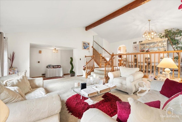 carpeted living room featuring an inviting chandelier and vaulted ceiling with beams