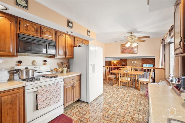 kitchen featuring white gas range oven and ceiling fan