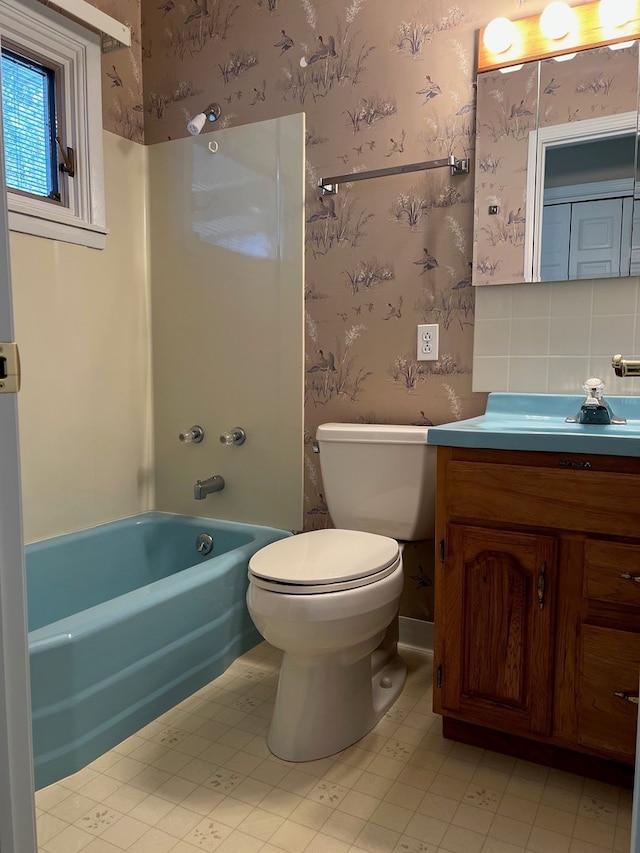 full bathroom featuring vanity, toilet, and shower / bath combination