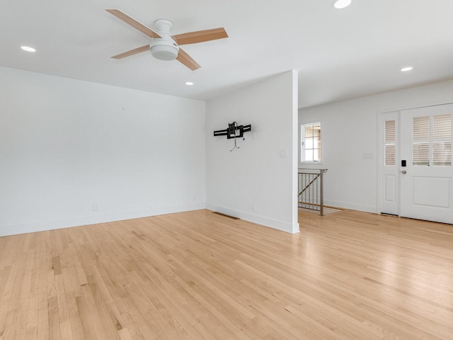 unfurnished room featuring ceiling fan and light hardwood / wood-style flooring