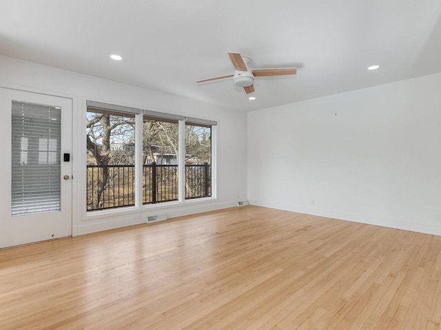 unfurnished room with ceiling fan and light hardwood / wood-style flooring