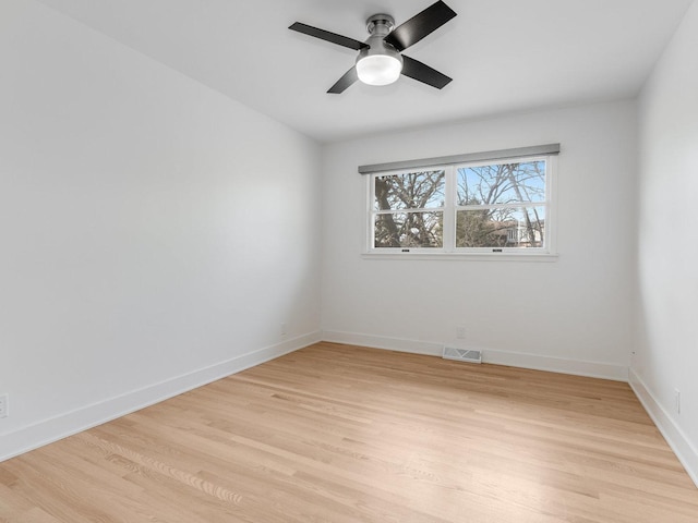 unfurnished room with ceiling fan and light wood-type flooring