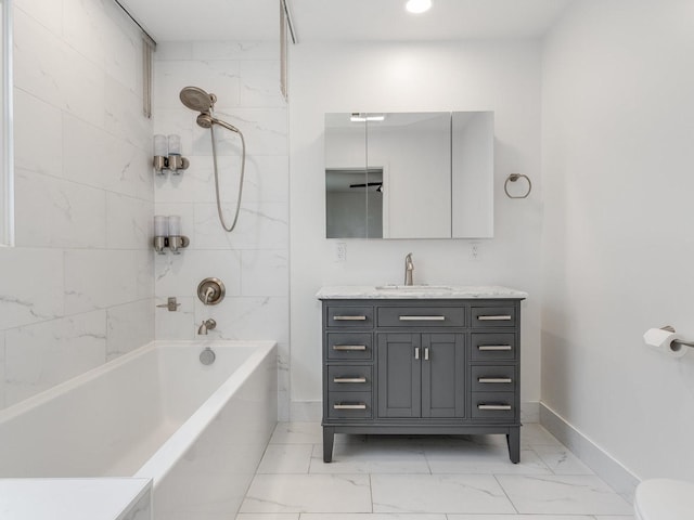 bathroom featuring vanity and tiled shower / bath combo