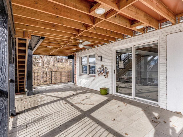 wooden terrace with a patio