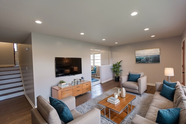 living room with dark hardwood / wood-style flooring