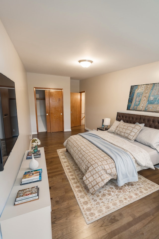 bedroom featuring dark hardwood / wood-style flooring