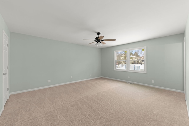 empty room with light carpet and ceiling fan