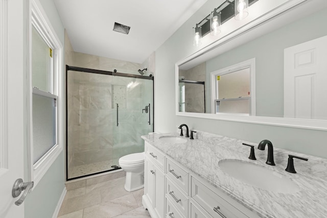 bathroom featuring walk in shower, vanity, and toilet