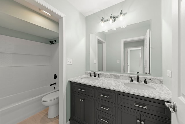 full bathroom featuring vanity, tub / shower combination, and toilet