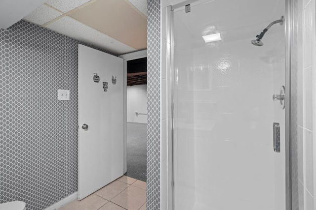 bathroom featuring tile patterned flooring and a shower