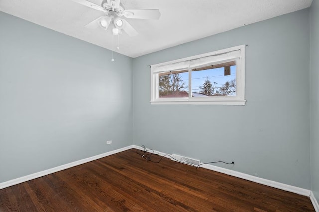 empty room with ceiling fan and hardwood / wood-style floors