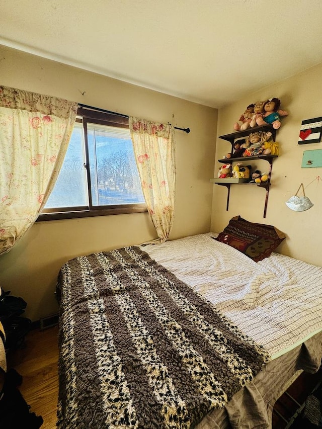 bedroom with wood-type flooring