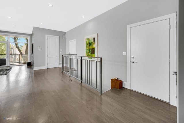 entrance foyer with dark hardwood / wood-style floors