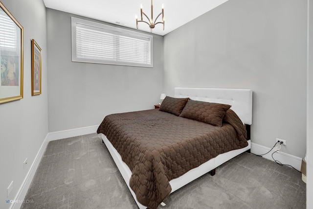 bedroom featuring carpet floors and a notable chandelier