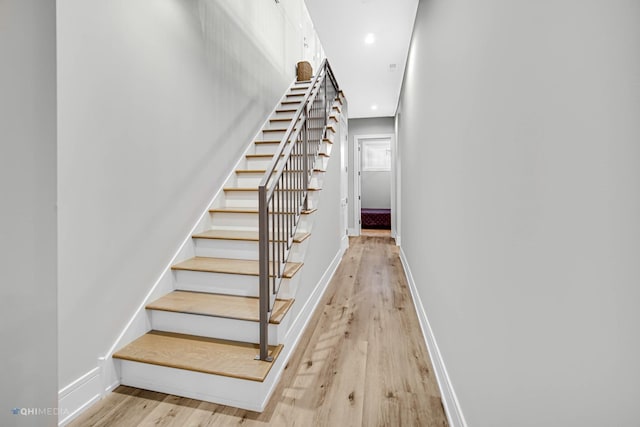 stairs with wood-type flooring