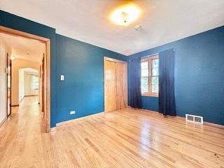 unfurnished room with light wood-type flooring