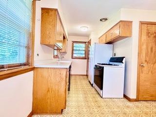 kitchen with white gas range