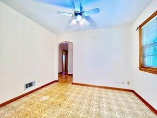 unfurnished room featuring ceiling fan