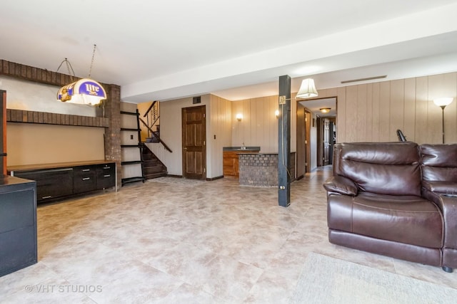 living room with wooden walls