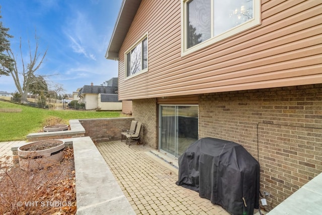 view of patio / terrace featuring grilling area and an outdoor fire pit