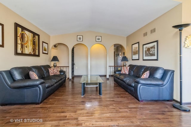 living room with hardwood / wood-style flooring and vaulted ceiling