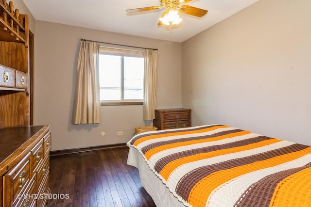 bedroom with ceiling fan and dark hardwood / wood-style flooring