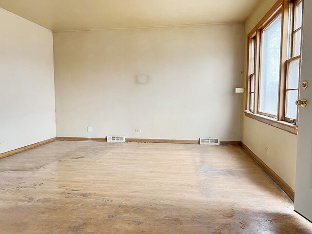 unfurnished dining area featuring dark wood-type flooring and a chandelier