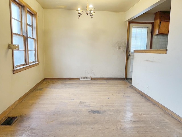 interior space featuring a notable chandelier and light hardwood / wood-style floors