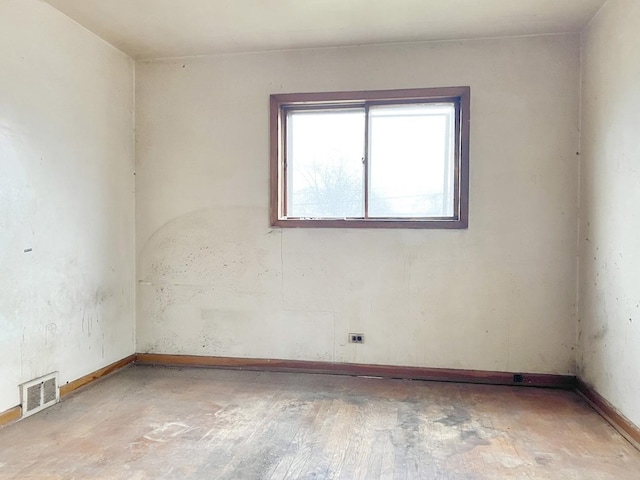 empty room featuring wood-type flooring