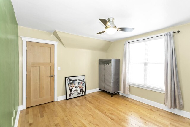 bonus room with vaulted ceiling, ceiling fan, and light wood-type flooring