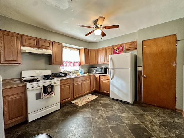 kitchen featuring ceiling fan, white appliances, and sink