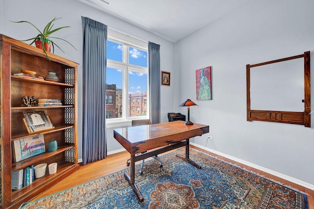 home office featuring hardwood / wood-style flooring