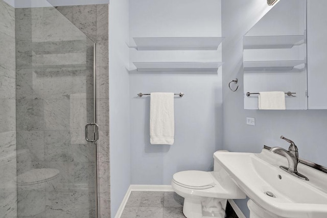 bathroom with sink, an enclosed shower, and toilet