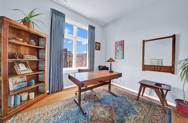 office space with hardwood / wood-style flooring