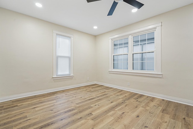 spare room featuring light hardwood / wood-style floors and ceiling fan