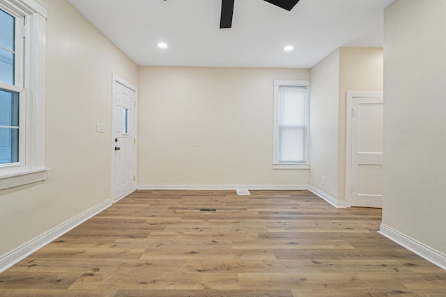 spare room with ceiling fan and light hardwood / wood-style flooring