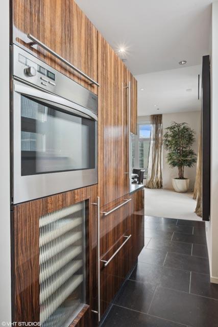 kitchen featuring dark tile patterned floors