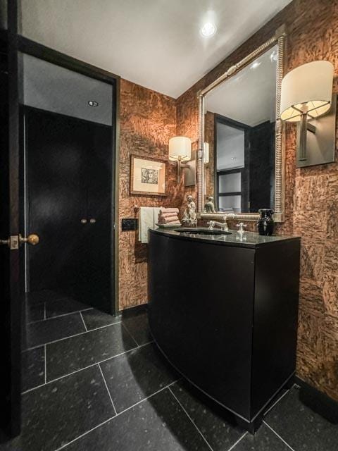 bathroom with tile patterned floors and vanity