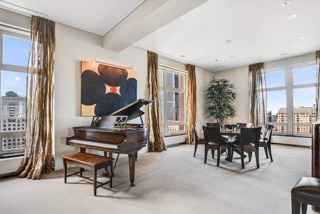 interior space featuring light carpet and a baseboard heating unit