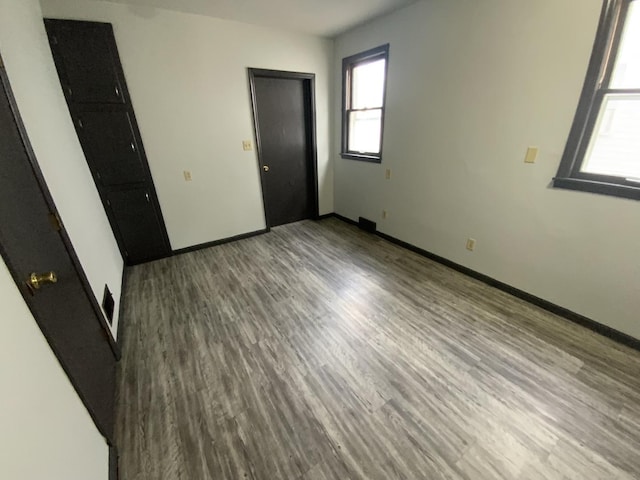 spare room with hardwood / wood-style flooring