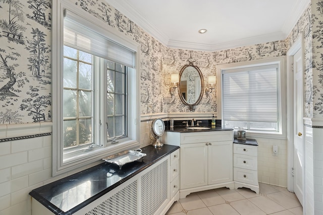 bathroom with ornamental molding, vanity, tile patterned floors, and tile walls