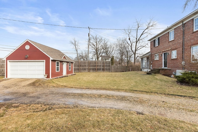 view of yard featuring an outbuilding and a garage