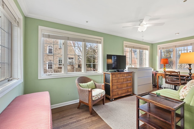 living room featuring hardwood / wood-style flooring, crown molding, and ceiling fan