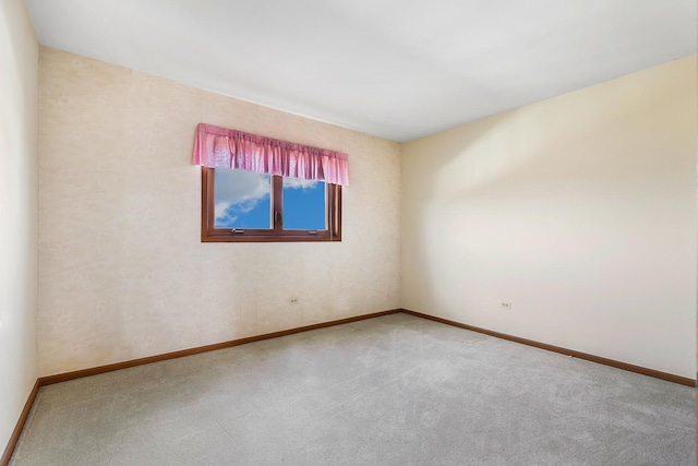 unfurnished room with carpet flooring